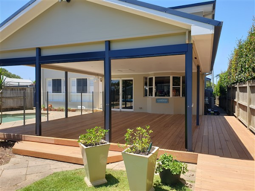Wooden backyard deck with pergola